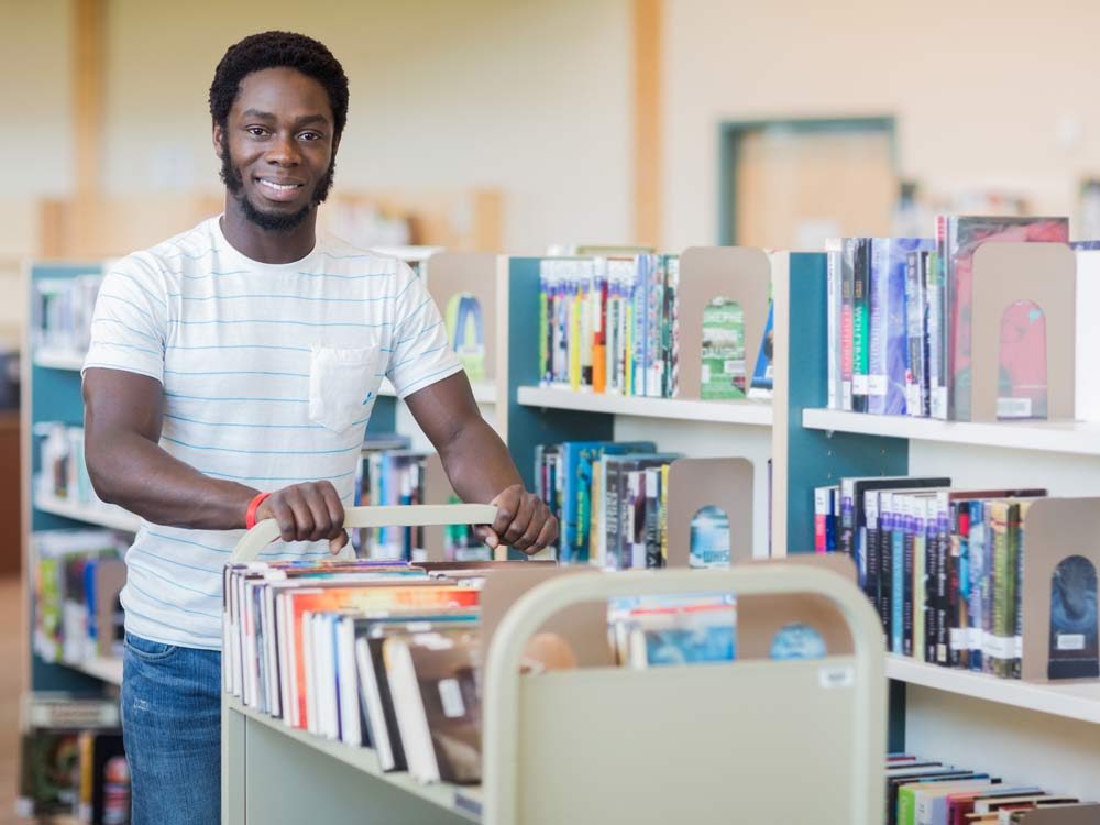 Male librarian at public library