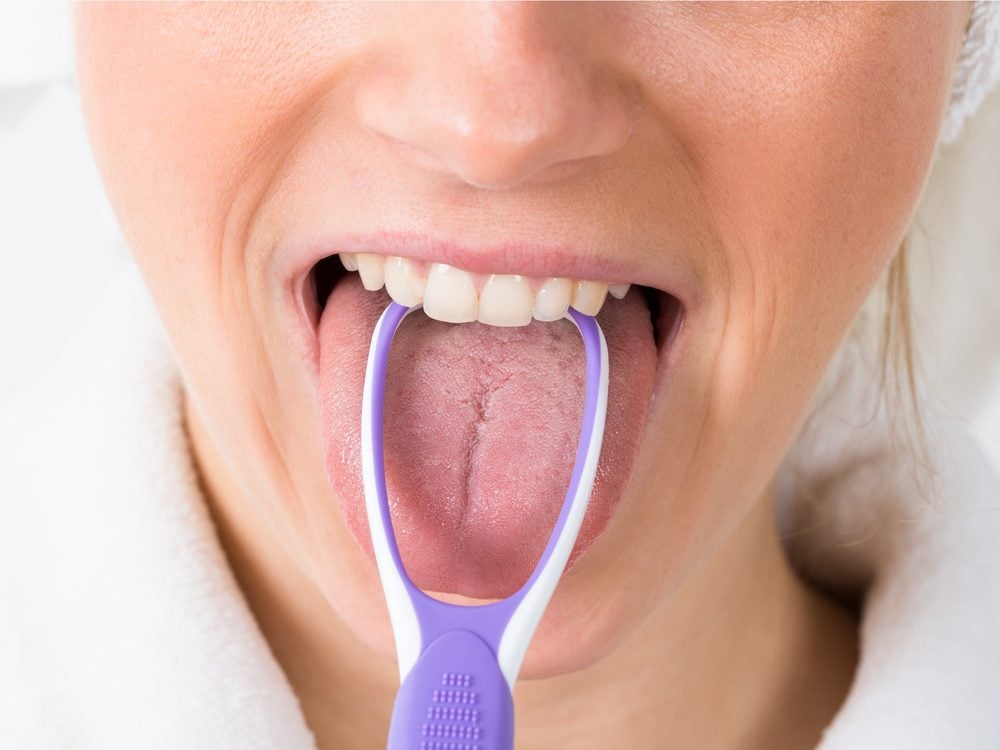Cleaning your tongue is a tip for healthy white teeth