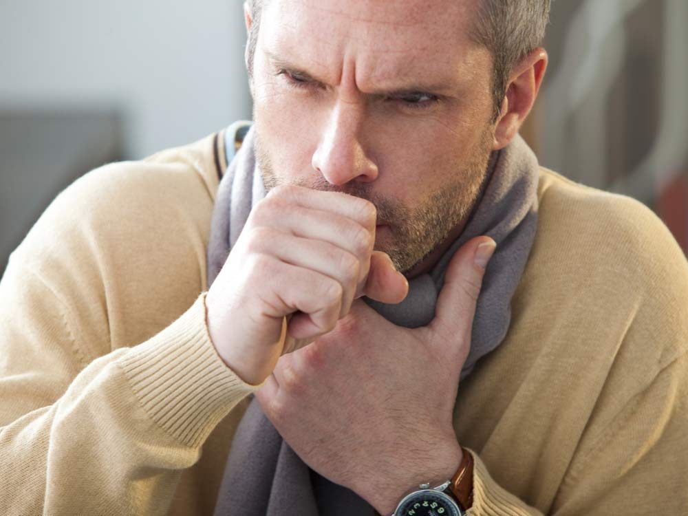 Middle-aged man coughing