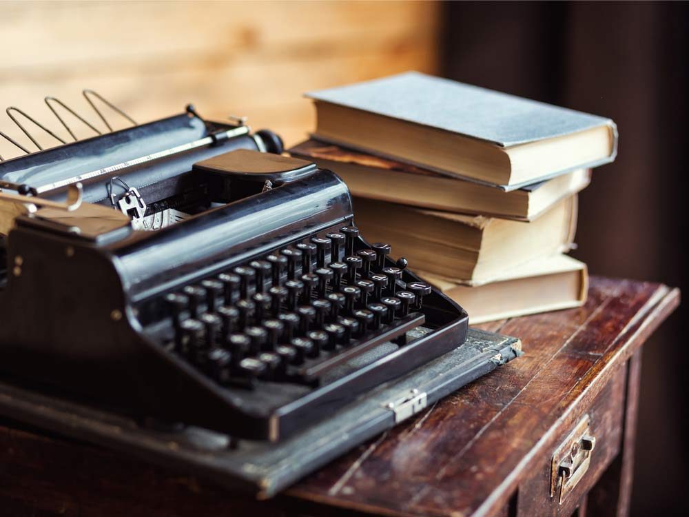 Typewriter and books