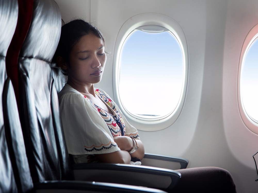 Woman sleeping on airplane