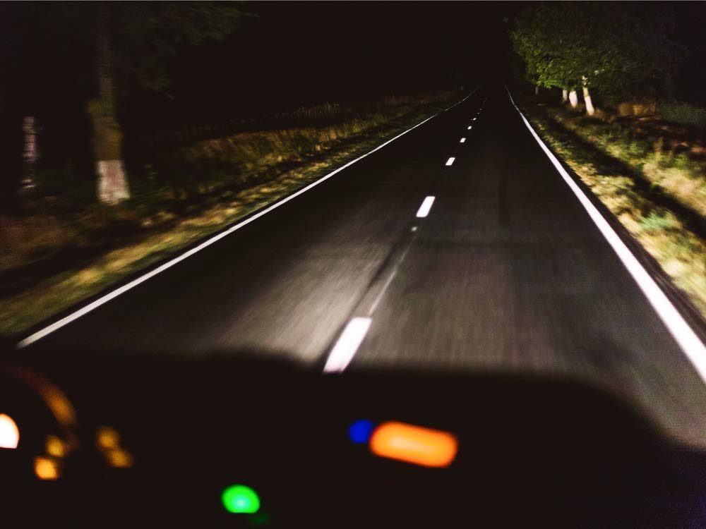 Car driving at nighttime