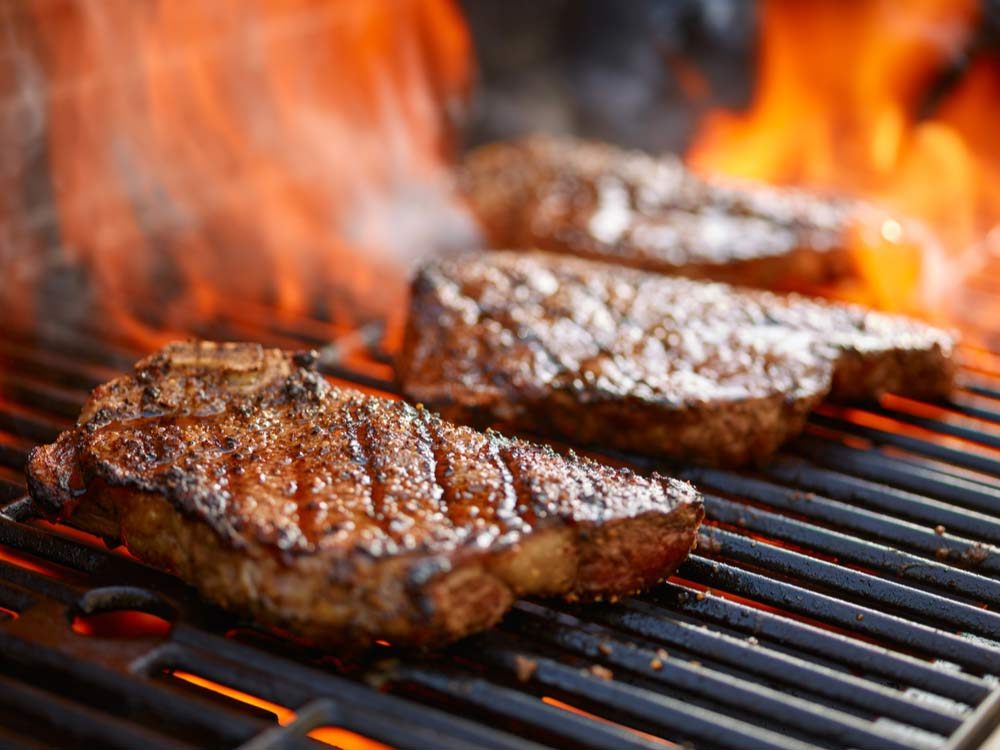Beef cooking on grill