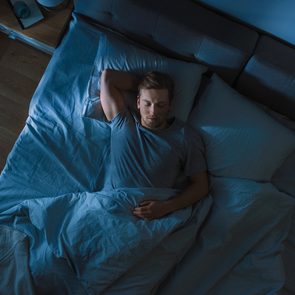 How much sleep do you need - Man sleeping in bed at night
