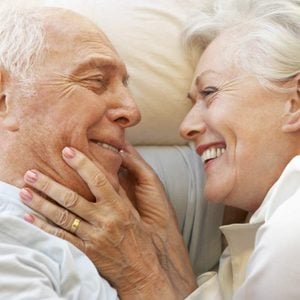 Sex after 50 - senior couple in bed