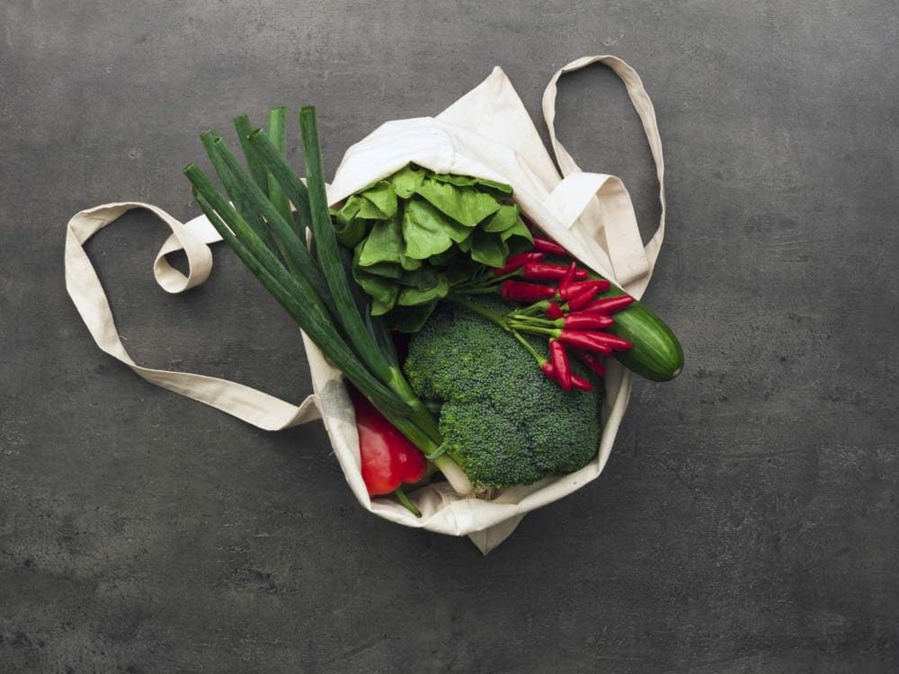 Reusable grocery bags with vegetables