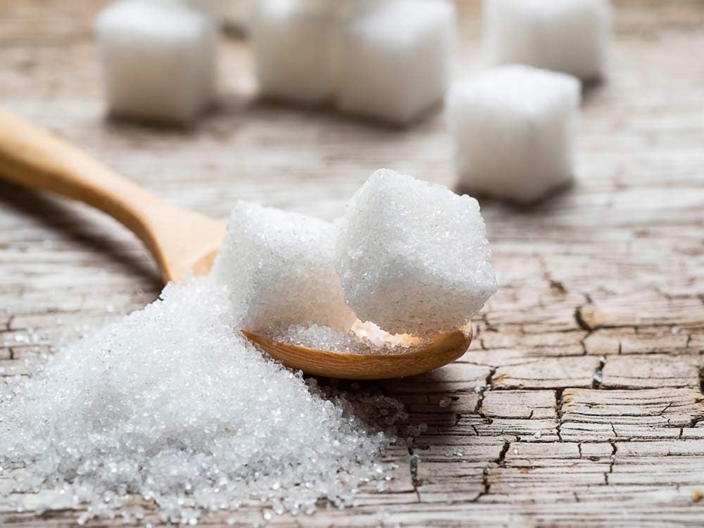 Sugar cubes on wooden table