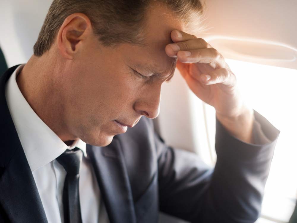 Stressed out man on flight