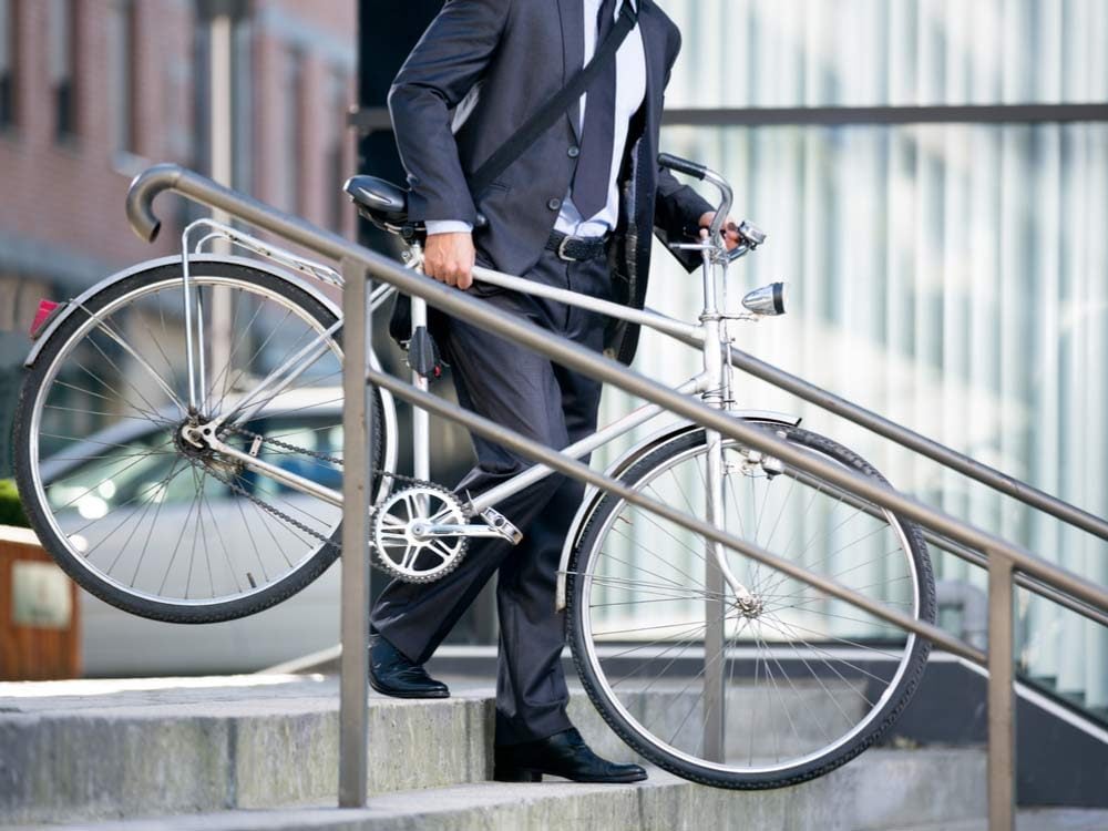Businessman biking to work
