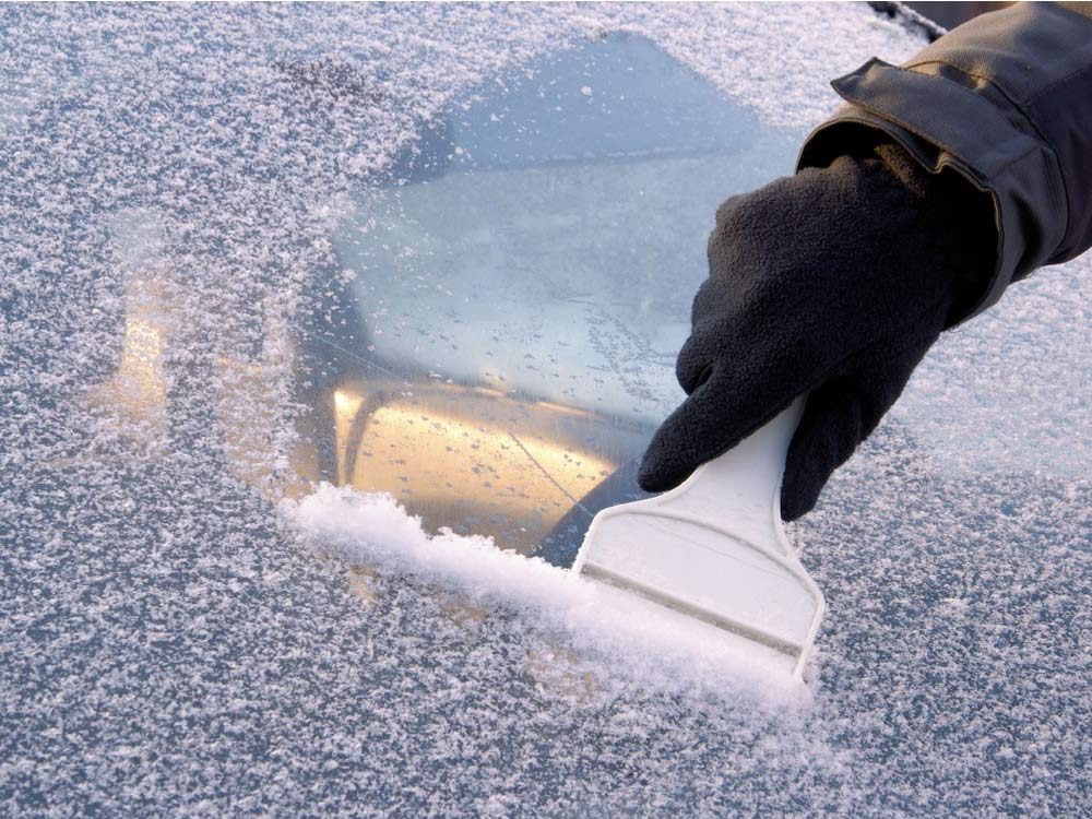 Scraping frost of windshield