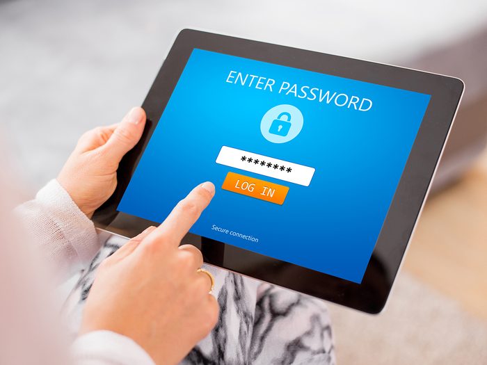 Worst passwords - woman entering password on tablet