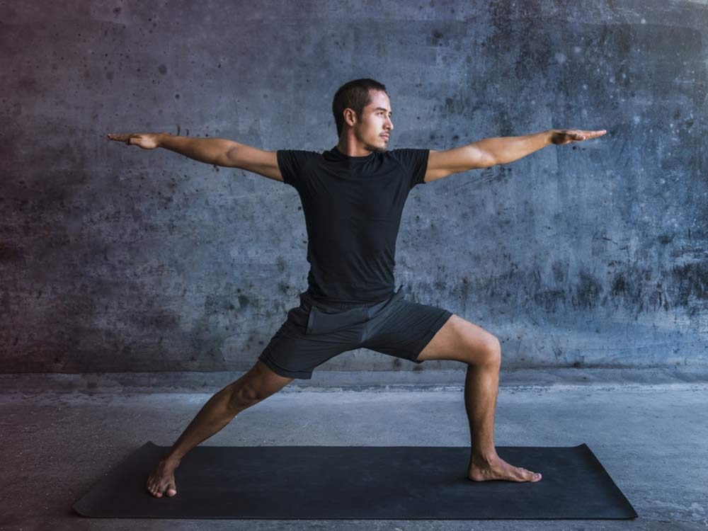 Man practicing advanced yoga