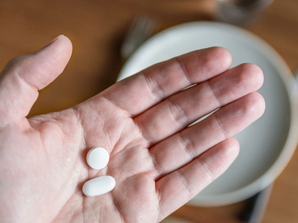 Male hands with prescription pills