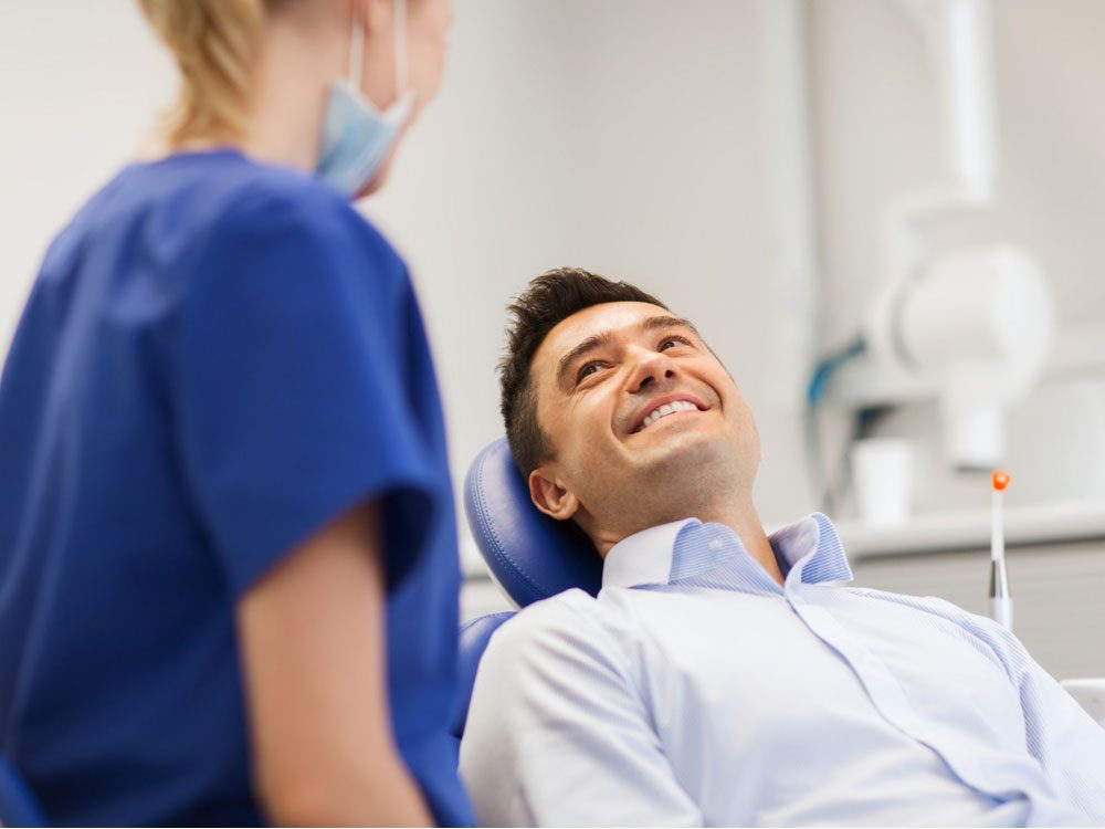 Man smiling at dentist's office