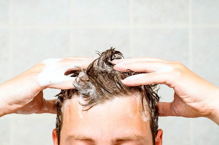 Washing hair and scalp in shower with conditioner
