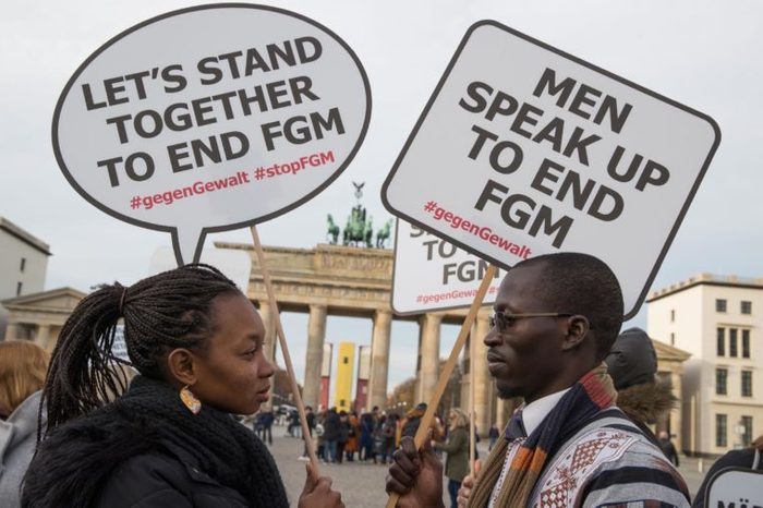 Participants of the rally against female genital mutilation hold placards at the Brandenburg Gate in Berlin, Germany, 23 November 2017. A group of activists 'TERRE DES FEMMES' organized the event ahead of the International Day for the Elimination of Violence against Women on 25 November which was designated by the United Nations.