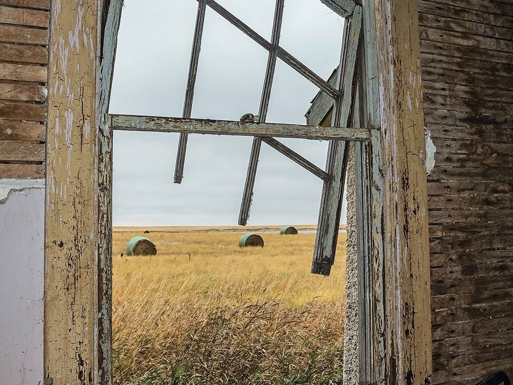 Saskatchewan ghost towns - prairies through an abandoned window