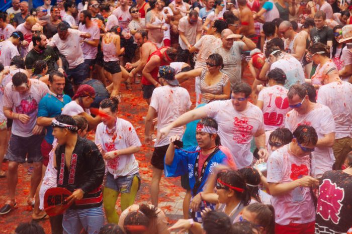 La Tomatina festival - tomatoes madness in August 28, 2013 in Bunol, Spain. Battle of tomatoes at street of city
