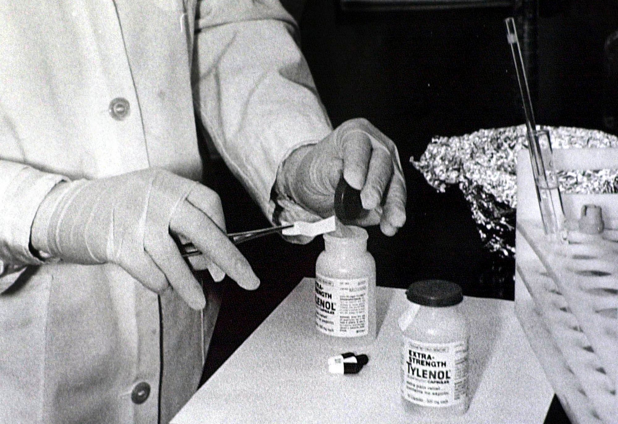 Bottles of Extra-Strength Tylenol are tested with a chemically treated paper that turns blue in the presence of cyanide at the Illinois Department of Health in Chicago. Arlington Heights, Ill., police say they'll take over the still-unsolved investigation into the deaths of seven people who took cyanide-laced Tylenol more than three decades ago. Local agencies will work together after the FBI decided to no longer lead the investigation into the 1982 Chicago area poisonings. The poisoned Tylenol was consumed over three days in Chicago and four suburbs, triggering a national scare and a huge recall Tylenol Poisonings, Chicago, USA