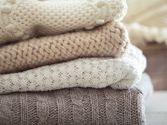 Use pillowcases to store sweaters