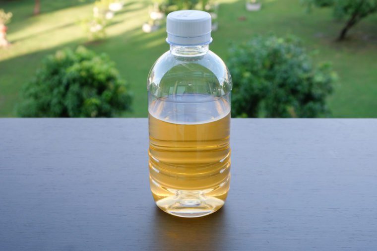 Yellow water in plastic bottle