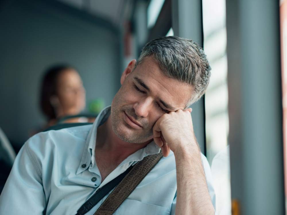 Man sleeping on public transportation