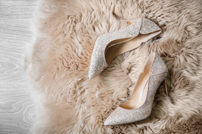 Beautiful high heeled shoes on furry rug