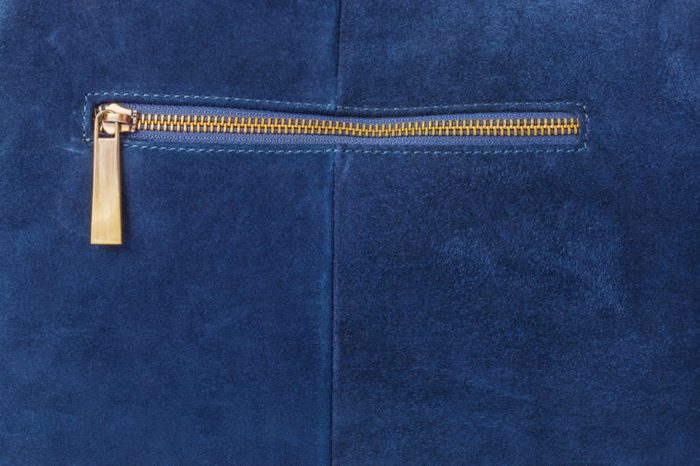 Pocket on blue handbag - fashion background
