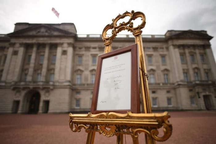 A notice is placed on an easel in the forecourt of Buckingham Palace in London to formally announce the birth of a baby boy to the Duke and Duchess of Cambridge at St Mary's Hospital.