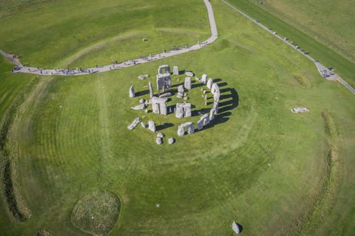 AMESBURY, WILTSHIRE, UNITED KINGDOM - OCTOBER 03, 2016: Aerial photograph of Stonehenge showing people visiting which is a UNESCO World Heritage Site in England.