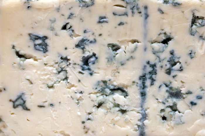 Close up of blue cheese. Cheese background