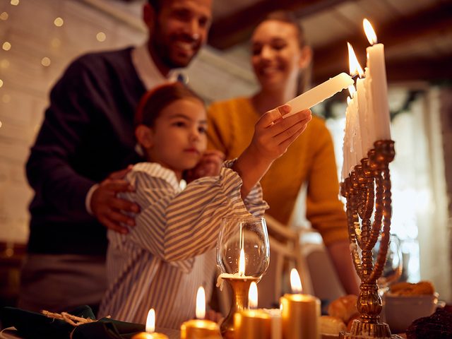 Hanukkah facts - family lighting hanukkiah