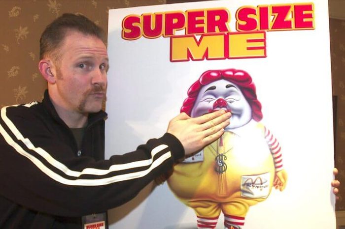 MORGAN SPURLOCK Morgan Spurlock, director, producer and star of the documentary film "Super Size Me" clowns with a movie poster at the U S Comedy Arts Festival, in Aspen, Colo. The documentary, which chronicles the deterioration of Spurlock's health during a monthlong experiment eating nothing but McDonald's food, won a directing prize at the Sundance Film Festival and is set for wide release this spring. McDonalds announced Wednesday that it will Supersize fries and drinks in its more than 13,000 U.S. restaurants and will stop selling them altogether by year's end, except in promotions