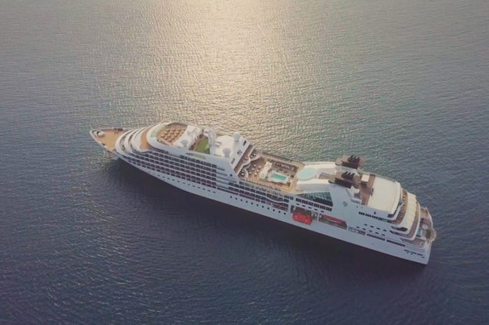 seabourn sojourn Luxury cruise ship sailing across The Ocean on beautiful sunset light - Aerial footage