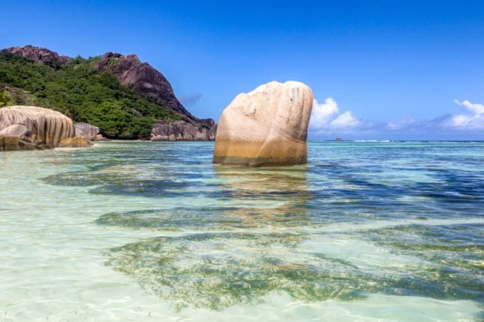 Granite rocks and turqouise water at the tropical beach Anse Source d'Argent on La Digue, Seychelles.