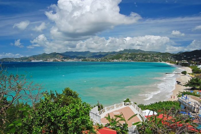 View of Grand Anse beach and tropical coast of Grenada island from coastal promenade