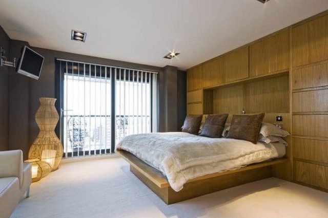 stunning luxury bedroom with a king size bed, wall mount plasma tv, sofa ...