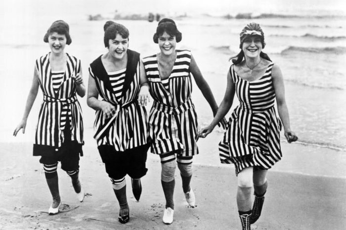 Four young women in matching beach wear