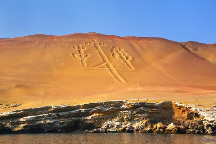Candelabra of the Andes in Pisco Bay, Peru. Candelabra is a well-known prehistoric geoglyph found on the northern face of the Paracas Peninsula
