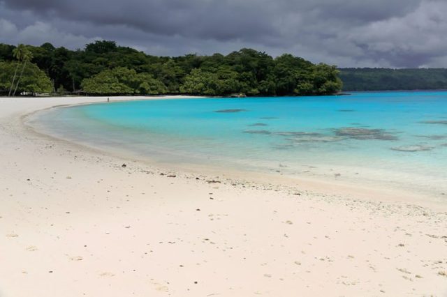 On the white sands and blue-green waters of Champagne beach in Hog Harbour bay closed on the N.by Elephant island the Americans celebrated the end of W.W.II. Espiritu Santo island-Sanma prov.-Vanuatu.