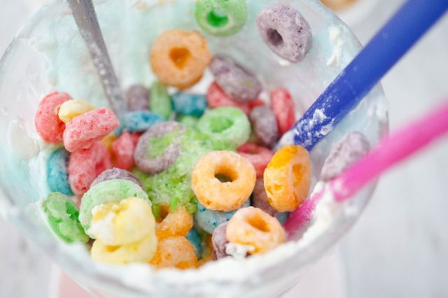 Colorful cereals left in glass, leftover food. Soft focus
