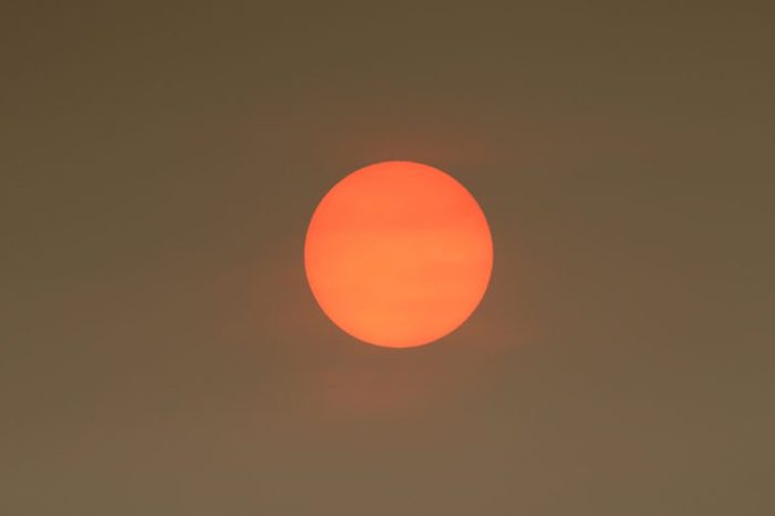 The Sun colour in the Uk was due to a weather phenomenon, Saharan dust, blown in by ex-hurricane Ophelia and also from debris, caused by fires in Portugal and Spain.