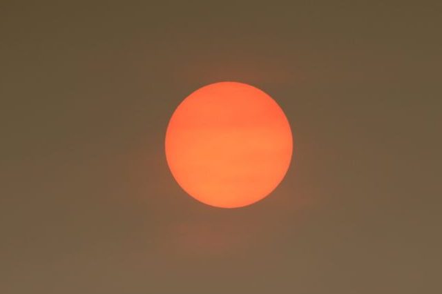 The Sun colour in the Uk was due to a weather phenomenon, Saharan dust, blown in by ex-hurricane Ophelia and also from debris, caused by fires in Portugal and Spain.