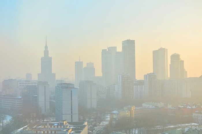 Characteristic view of a modern city skyline covered in a dense smog and pollution - Warsaw, Poland
