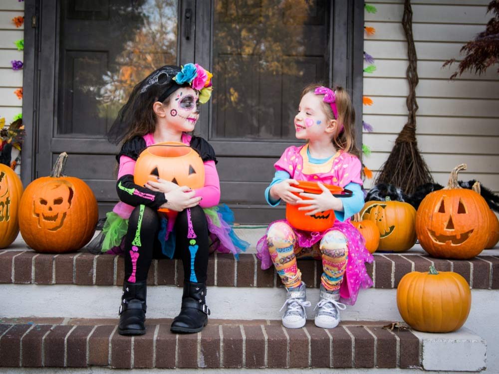 Little girls in Halloween costumes