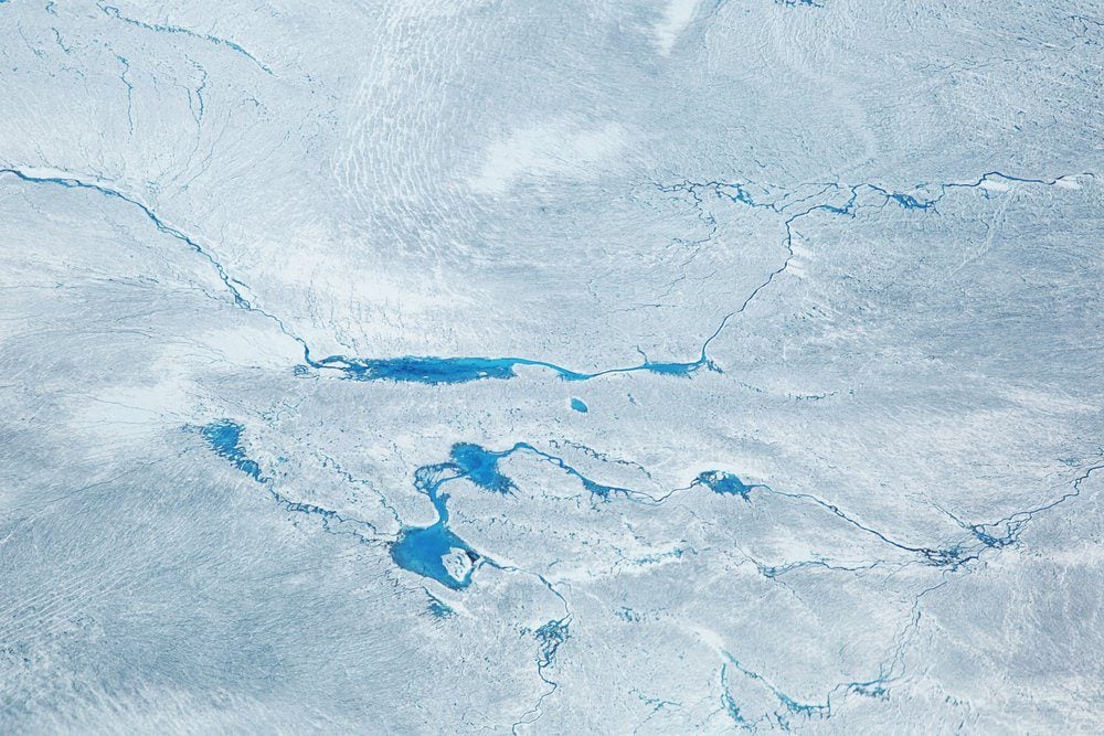 Supra glacial Lakes over the Ice Sheet in Greenland. Aerial Shot.