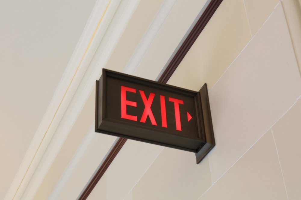Emergency exit sign hanging on the wall