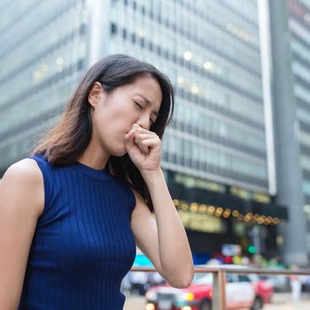 Woman cough at outdoor