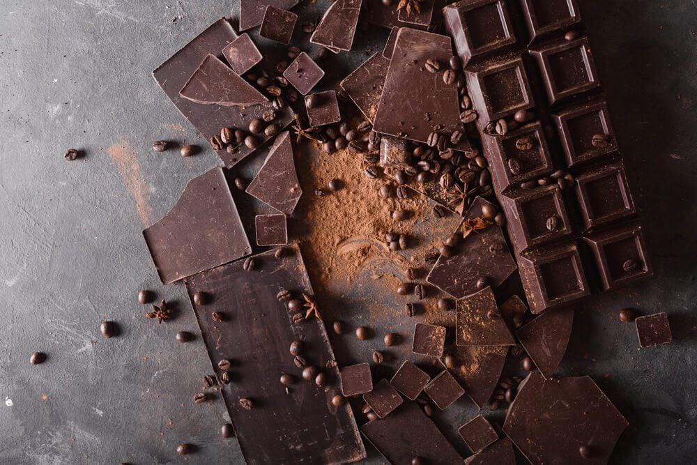 Chocolate chunks and cocoa powder. Sweet food photo concept. 