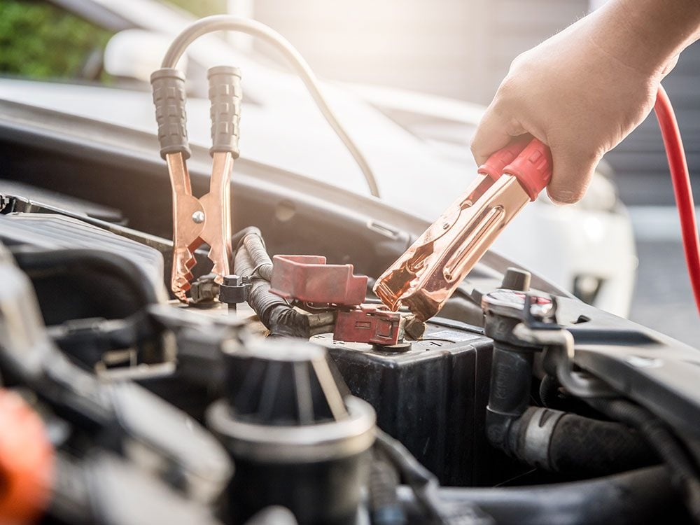 Using jumper cables to jump-start a car